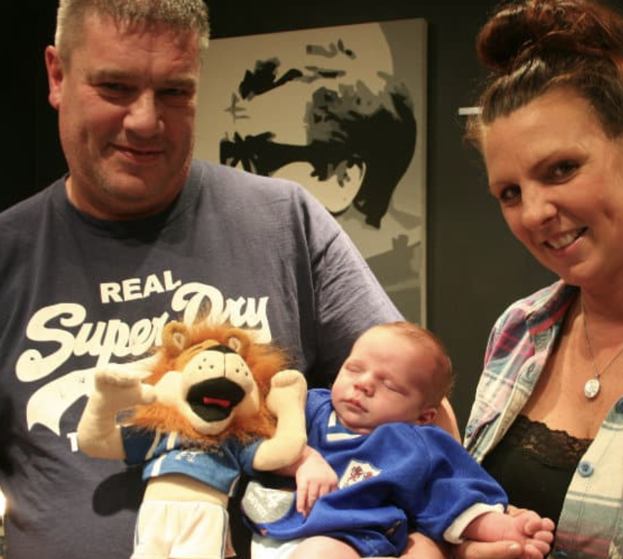 A baby in a Millwall top